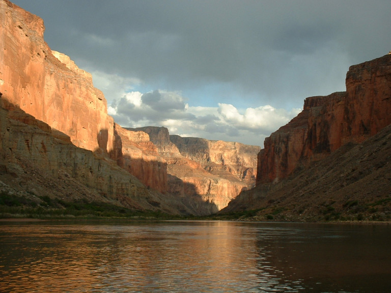 Canyon walls near Nankoweap reflected in a calm stretch of the river