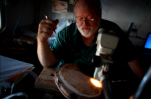 University of Arizona professor Tom Swetnam examines a tree sample at the Laboratory of Tree-Ring Research 