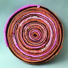 Concentric strips of cloth resembling tree rings.