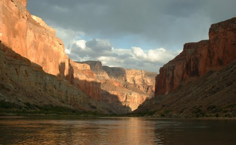 Canyon walls near Nankoweap reflected in a calm stretch of the river