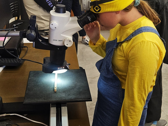 Hendrick Elementary student viewing a sample through the microscope.