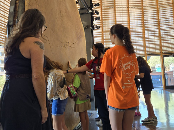 Dr. Pamela Pelletier with the Girl Scouts in front of the Giant Sequoia