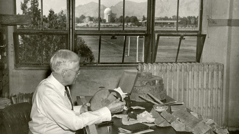 Douglass at his desk