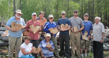 Group photo, holding cross-sections.
